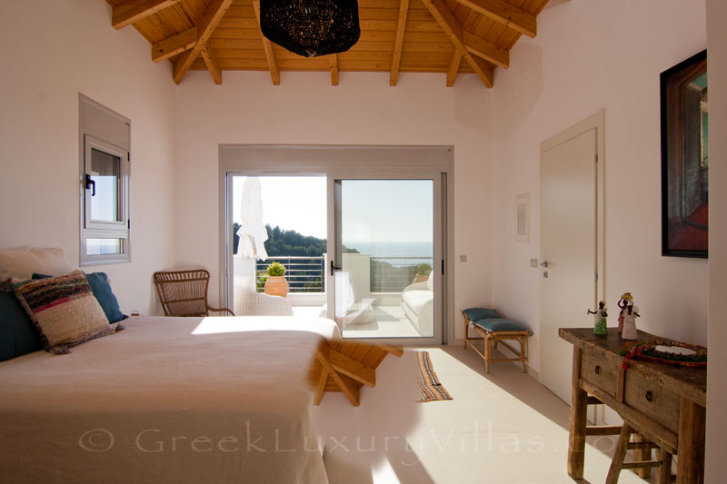 Bedroom with seaview in a modern luxury villa with a pool in Paxos