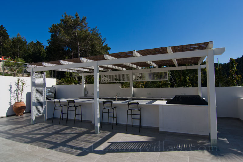 The pool bar of a modern luxury villa with seaview in Paxos