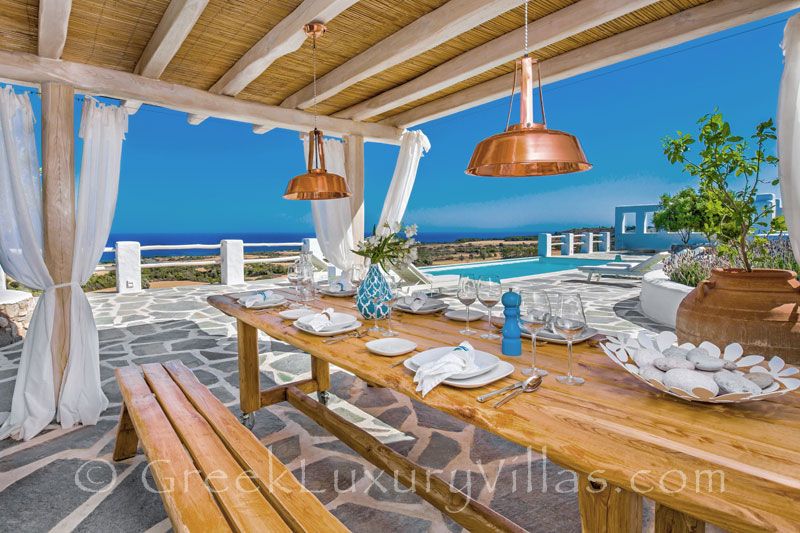 Dining area with a pergola in a luxury villa with a pool in Rhodes