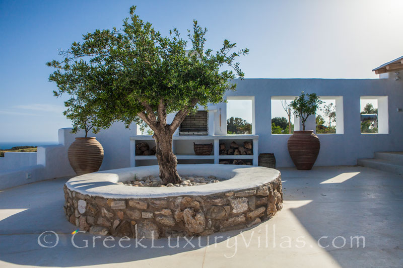 The bbq area of a luxury villa with a pool in Rhodes