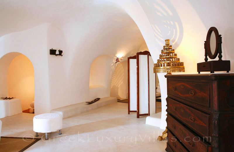 The cave style living-room of a luxurious villa in a traditional village in Santorini
