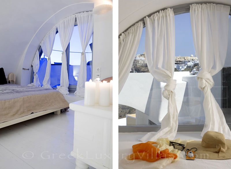 A bedroom of a luxury villa in Fira, Santorini, with sunset view
