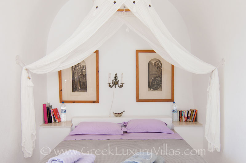 A bedroom with chapel in large villa with a pool on the cliff of Santorini