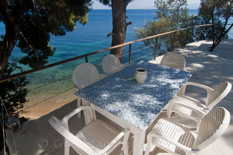 Beach of beachfront cottage in Skiathos