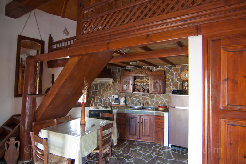 The kitchen and the lounge of a windmill near the beach in Skyros