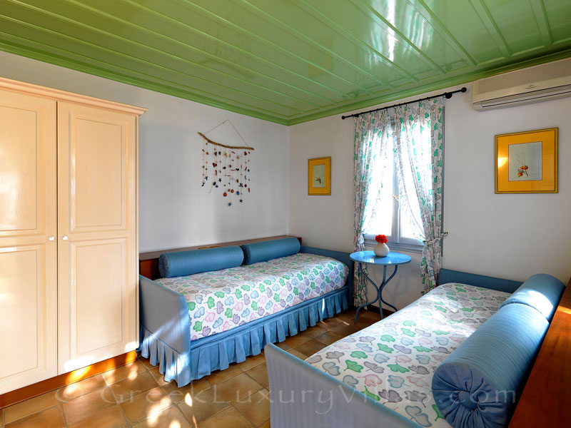 Guest bedroom of beachfront villa in Skyros