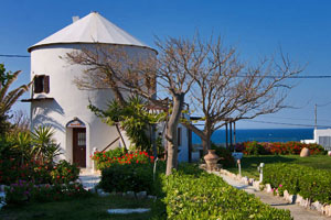 Windmill by the beach on Skyros, Greece