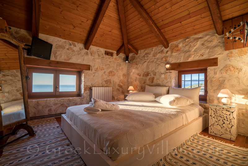 The bedroom of a seafront villa with a pool in Zakynthos