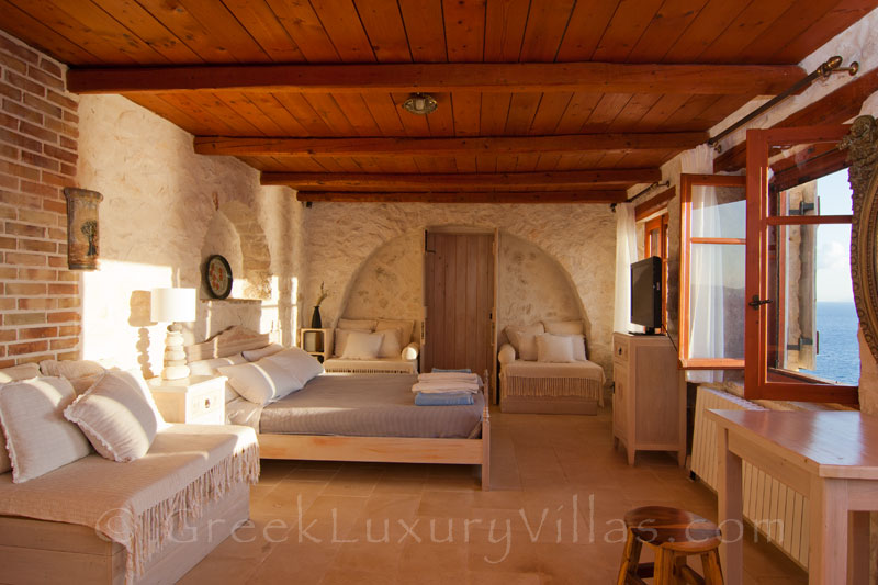 A bedroom of a villa with a pool in Zakynthos