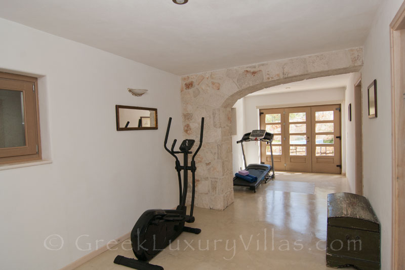 The gym of a villa with a pool in Zakynthos