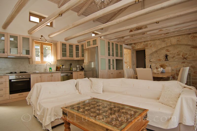 The open plan lounge of a seaview villa with a pool in Zakynthos