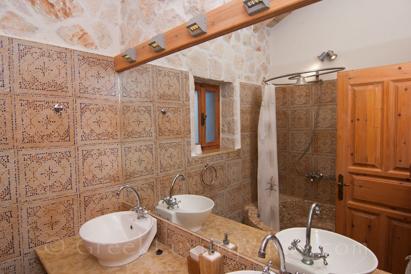 A bathroom of the villa with seaview and a pool